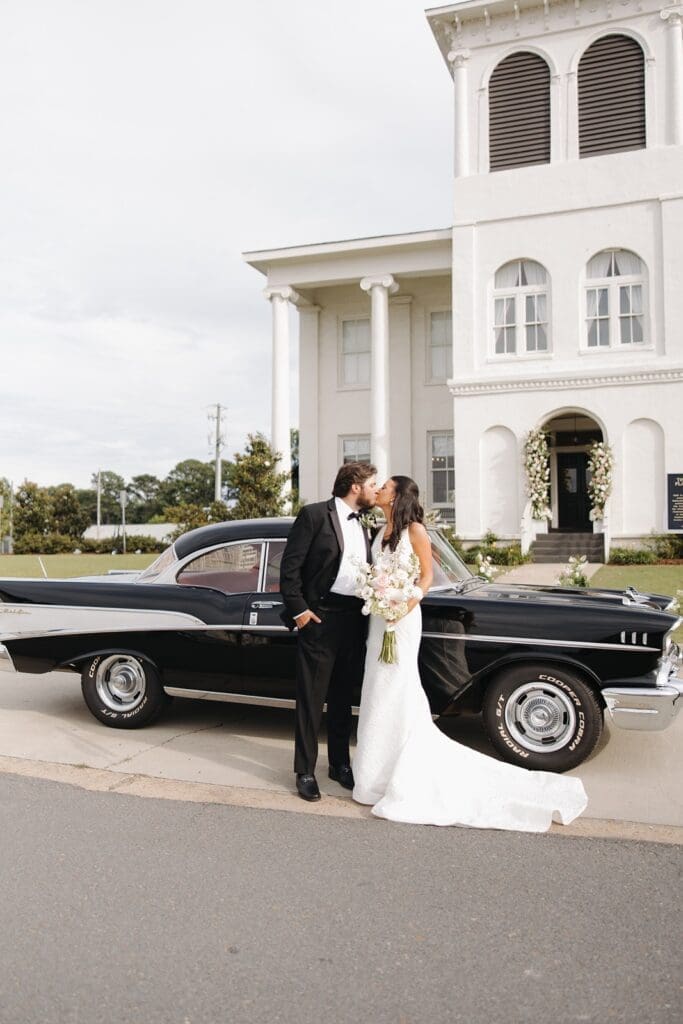 Couples portrait with vintage car